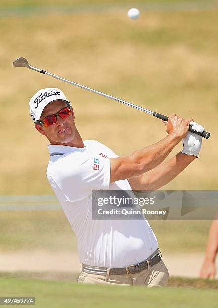 Adam Scott of Australia plays out of the bunker during a practice round ahead of the 2015 Australian Masters at Huntingdale Golf Course on November...