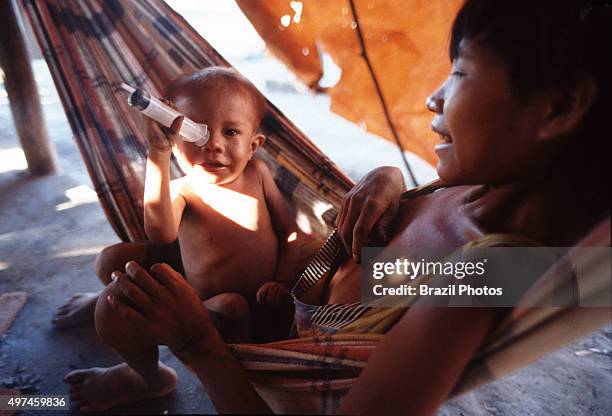 Sick malnourished Yanomami family at "Indians House" at Boa Vista city in Roraima State, Amazon, north Brazil.