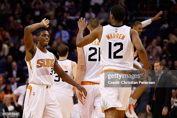 Brandon Knight of the Phoenix Suns high-fives T.J. Warren after scoring against the Los Angeles Lakers during the second half of the NBA game at...