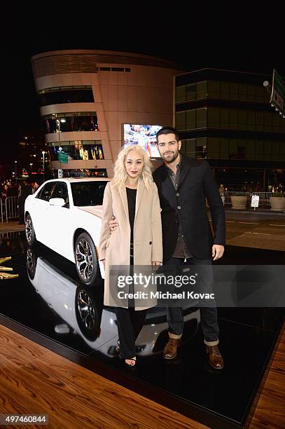 Actors Cara Santana and Jesse Metcalfe attend "Hunger Games: Mockingjay Part 2" Los Angeles Premiere Sponsored By Chrysler on November 16, 2015 in...