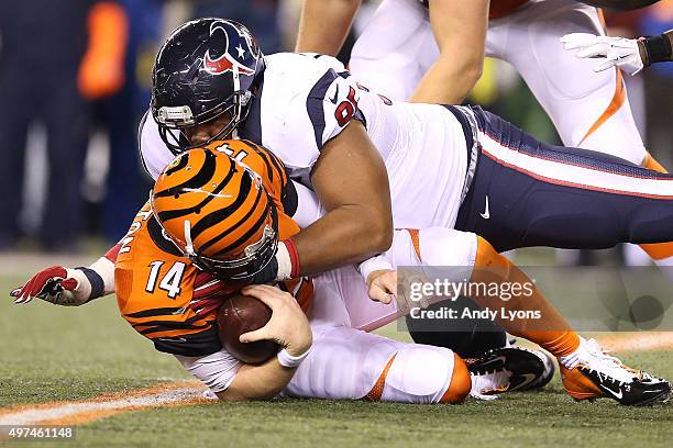 Christian Covington of the Houston Texans sacks Andy Dalton of the Cincinnati Bengals during the third quarter at Paul Brown Stadium on November 16,...