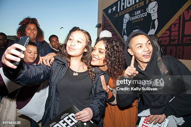 Actress Tessa Thompson poses with a student at the mural unveiling for her upcoming movie "Creed" at Leadership High School on November 16, 2015 in...