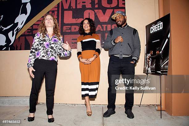 Leadership High School Principal Beth Silbergeld, actress Tessa Thompson, and director Ryan Coogler speak to a group of students at the mural...