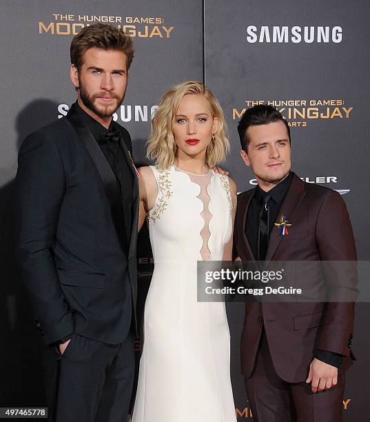 Actors Liam Hemsworth, Jennifer Lawrence and Josh Hutcherson arrive at the premiere of Lionsgate's "The Hunger Games: Mockingjay - Part 2" at...