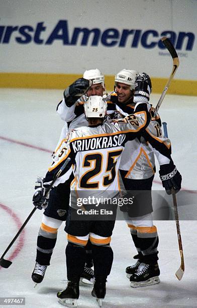 Rob Valicevic of the Nashville Predators is congratulated by David Legwand and Sergei Krivokrasov during a game against the Atlanta Thrashers at the...