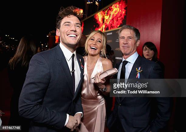 Actor Sam Claflin, Laurie Feltheimer and Lionsgate CEO Jon Feltheimer attend premiere of Lionsgate's "The Hunger Games: Mockingjay - Part 2" at...