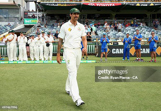 Mitchell Johnson of Australia leads his team out to field in his final test match during day five of the second Test match between Australia and New...