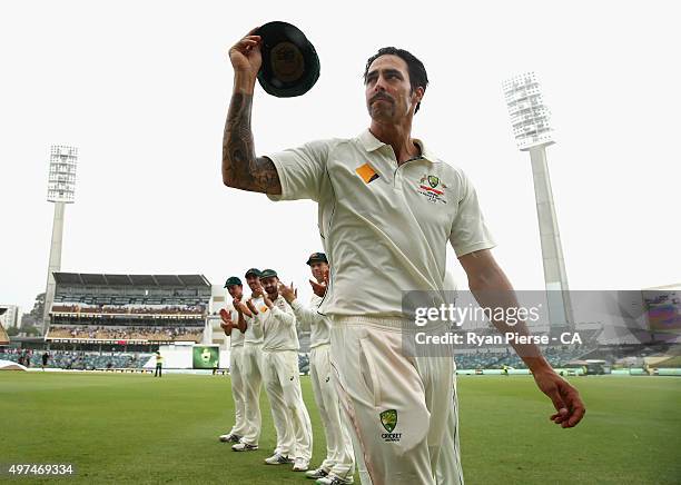 Mitchell Johnson of Australia leaves the ground during a rain delay in his final test match during day five of the second Test match between...