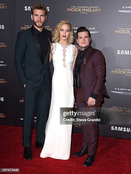 Actors Liam Hemsworth, Jennifer Lawrence, and Josh Hutcherson arrives at the Premiere Of Lionsgate's "The Hunger Games: Mockingjay - Part 2" at...