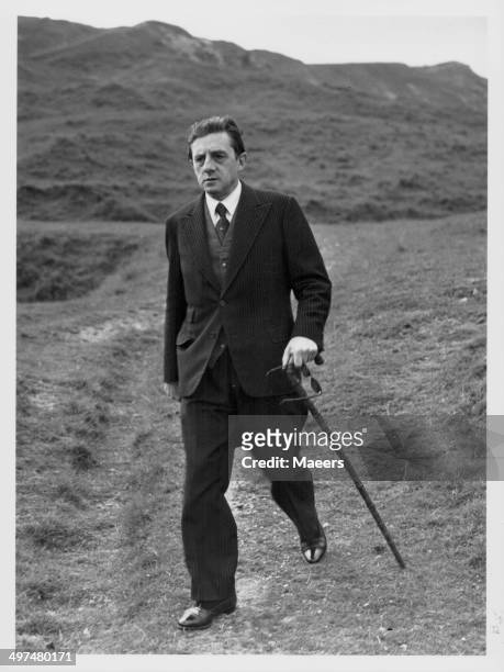 Conductor Sir John Barbirolli taking a stroll in the Cotswolds at Cleeve Hill, July 7th 1951.
