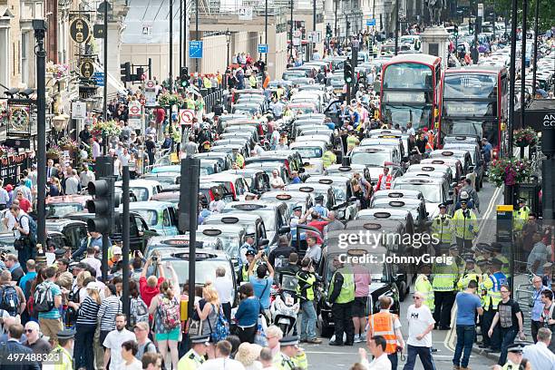 london black cabs protest against uber - software demo stock pictures, royalty-free photos & images