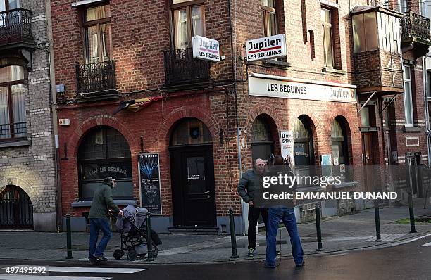 Journalists work in front of the bar "Les Beguines", owned by Brahim Abdeslam, one of the suicide bombers implicated in the Paris attacks, on...