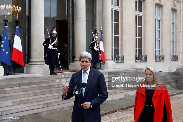 Secretary of State John Kerry, with US ambassador in Paris Jane Hartley, talks to the media after a meeting with French President Francois Hollande...