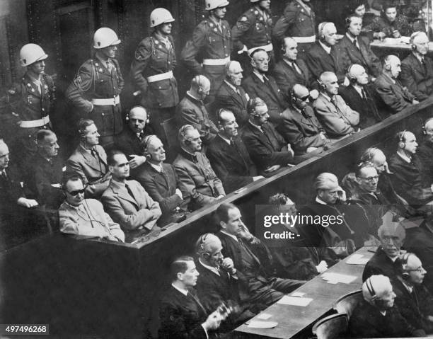 Of the 22 nazi leaders accused of war crimes during the world war II listen to the prosecution 01 October 1946 at the Nuremberg court. From L to R:...