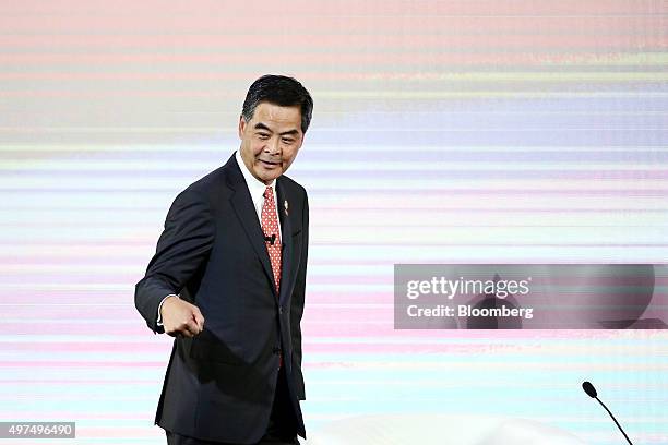 Leung Chun-ying, Hong Kong's chief executive, gestures as he arrives on stage at the Asia-Pacific Economic Cooperation CEO Summit in Manila, the...