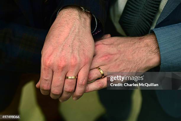 Newly married couple Richard Dowling and Cormac Gollogly display their wedding rings after the first ever same sex marriage takes place on November...