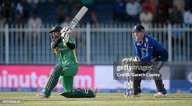 Mohammad Hafeez of Pakistan hits out for six runs during the 3rd One Day International match between Pakistan and England at Sharjah Cricket Stadium...