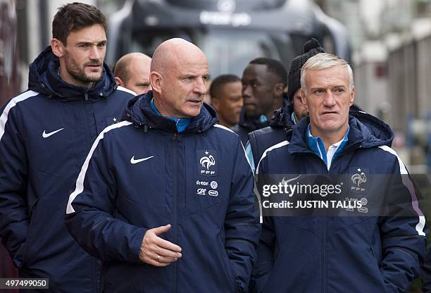 France's head coach Didier Deschamps , assistant coach Guy Stephan and goalkeeper Hugo Lloris with players and staff of the France football team, go...