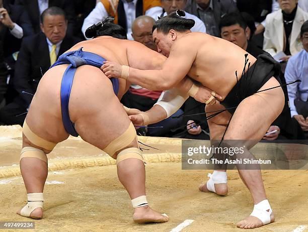 Mongolian yokozuna Harumafuji and Ozeki Kotoshogiku compete during day ten of the Grand Sumo Kyushu Tournament at Fukuoka Convention Cetner on...