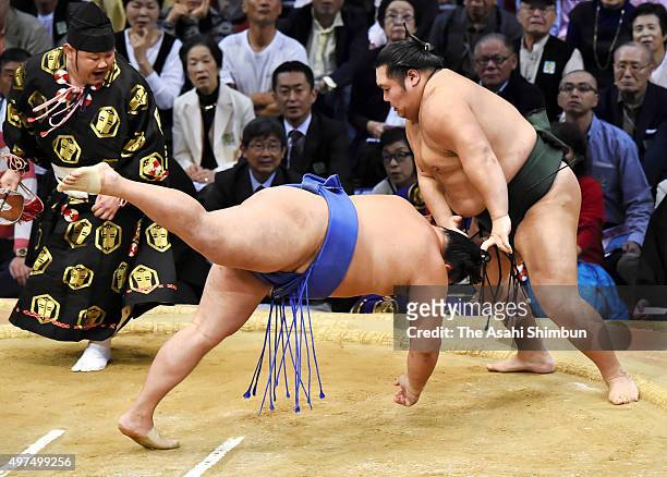 Chiyotairyu throws Mongolian wrestler Tamawashi to win during day ten of the Grand Sumo Kyushu Tournament at Fukuoka Convention Cetner on November...