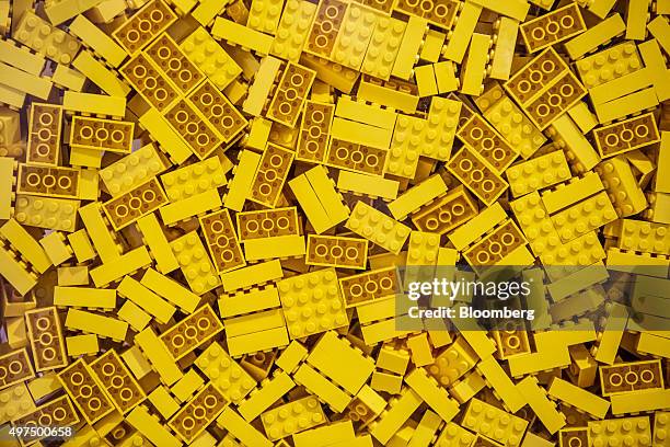 Yellow toy bricks sit in a container at the Lego A/S Factory in Kladno, Czech Republic, on Monday, Nov. 16, 2015. Lego A/S, Europe's biggest...