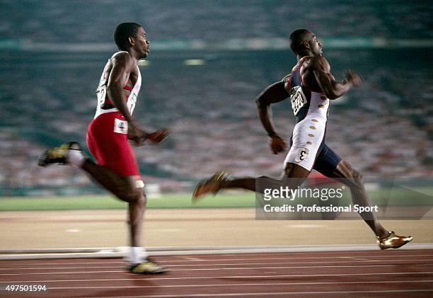 Michael Johnson of the United States en route to winning the gold medal from Frankie Fredericks of Namibia in the men's 200 metres event during the...