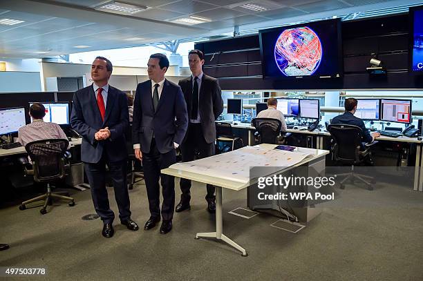 Chancellor of the Exchequer George Osborne is shown the 24 hour Operations Room inside GCHQ, Cheltenham by the Director of GCHQ Robert Hannigan and...