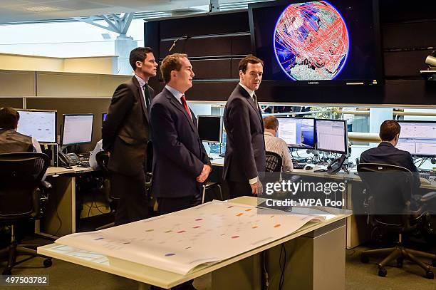 Chancellor of the Exchequer George Osborne is shown the 24 hour Operations Room inside GCHQ, Cheltenham by the Director of GCHQ Robert Hannigan and...