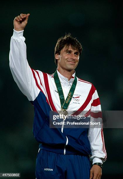 Czech javelin thrower Jan Zelezny of the Czechoslovakia team stands on the medal podium after receiving his gold medal for finishing in first place...