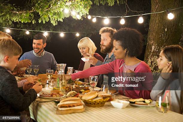 evening family picnic party - night picnic stock pictures, royalty-free photos & images