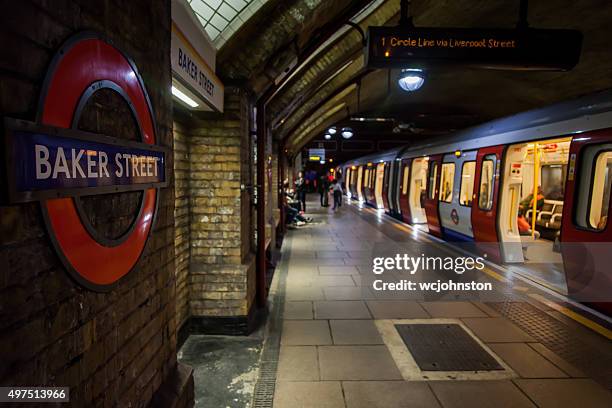 u-bahn-station baker street in london - baker street stock-fotos und bilder