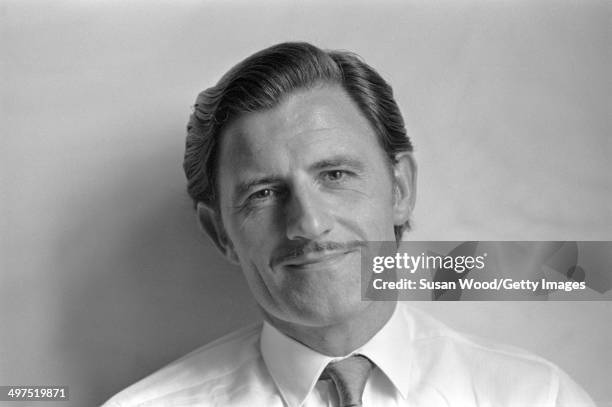 Portrait Of British racecar driver and team owner Graham Hill , England, January 1970.