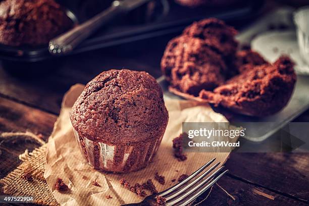 delicious homemade chocolate muffins - muffin stockfoto's en -beelden