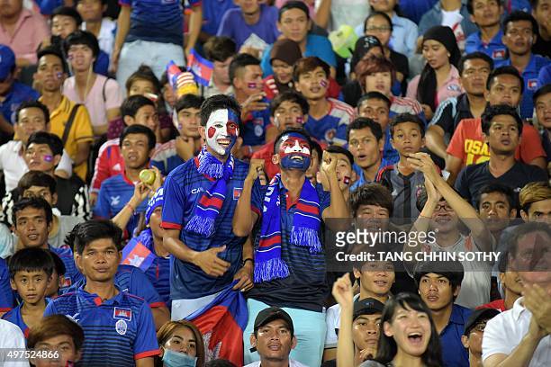 Cambodian fans shout slogans during group E football match in round 2 of the 2018 FIFA World Cup qualification preliminaries at the National Olympic...