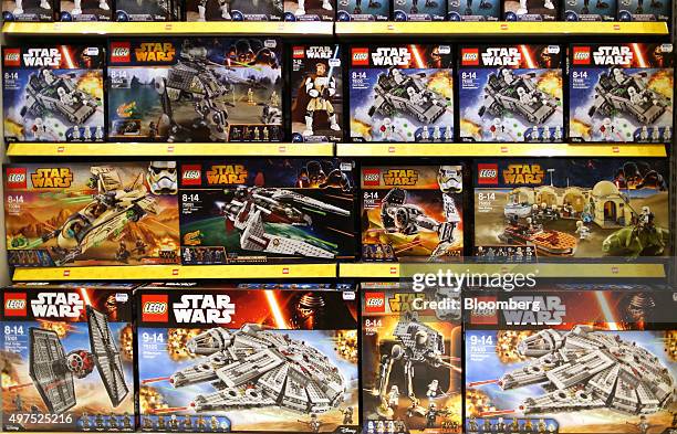 Boxes of Lego Star Wars toys, manufactured by Lego A/S, stand on display at a toy store in London, U.K., on Tuesday, Nov. 17, 2015. U.K. Consumer...