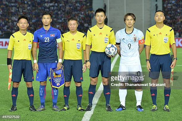 Shinji Okazaki of Japan and Thierry Chantha Bin of Cambodia pose during the 2018 FIFA World Cup Qualifier match between Cambodia and Japan on...