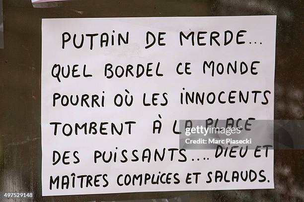 Tributes and flowers are left near the 'La Belle Equipe' restaurant on November 17, 2015 in Paris, France. Paris remains under heightened security...