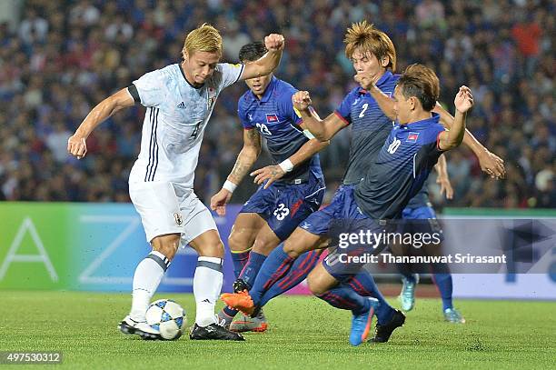 Keisuke Honda of Japan kicks the ball during the 2018 FIFA World Cup Qualifier match between Cambodia and Japan on November 17, 2015 in Phnom Penh,...