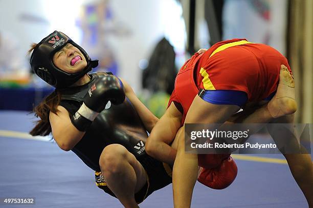 Sanathoi Devi Yumnam of India competes against Hyebin Kim of Korea in the semi-final Women's 52kg Sanda Competition during the 2015 World Wushu...