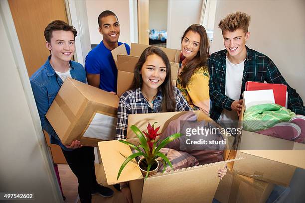 student accommodation friends - teen packing suitcase stock pictures, royalty-free photos & images
