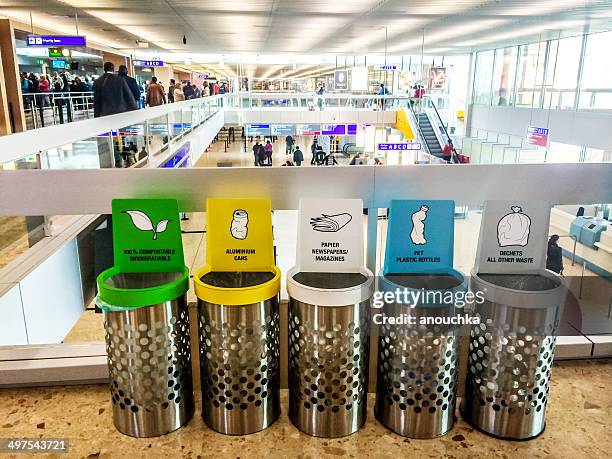 separated trash cans in geneva airport - geneve airport stock pictures, royalty-free photos & images
