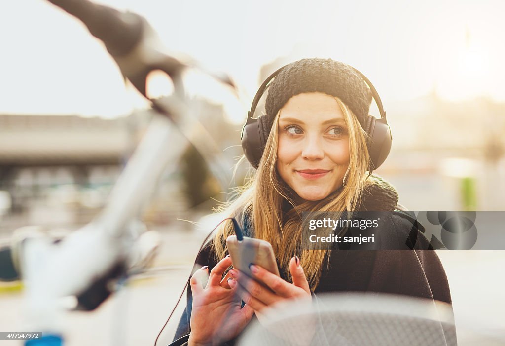 Teenage girl listening music with smartphone