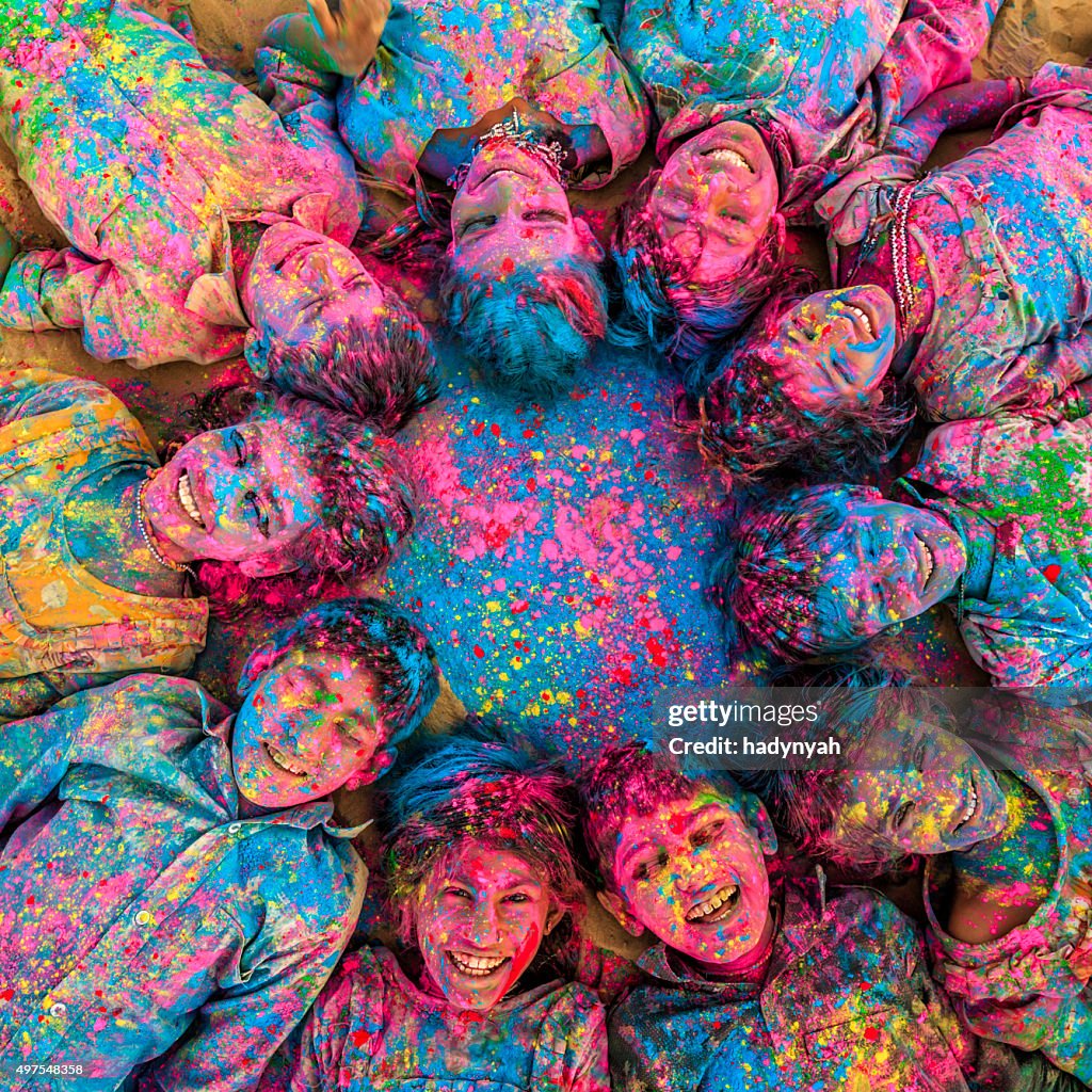 Group of happy Indian children playing holi, desert village, India