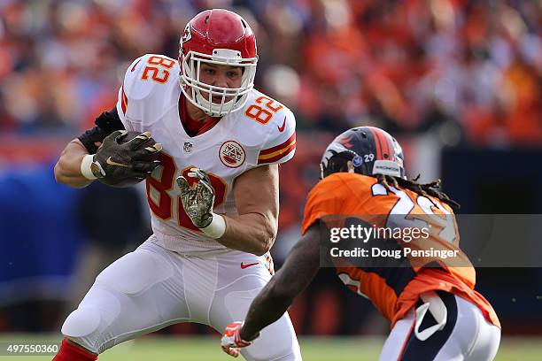 Brian Parker of the Kansas City Chiefs makes a pass reception against the defense of Bradley Roby of the Denver Broncos at Sports Authority Field at...