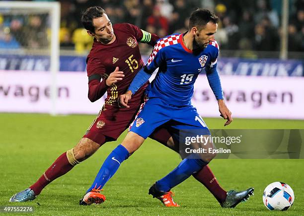 Roman Shirokov of Russia is challenged by Milan Badelj of Croatia during the international friendly football match between Russia and Croatia at...