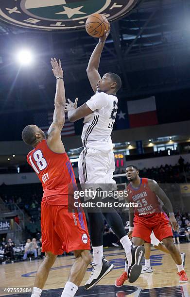 Cady Lalanne of the Austin Spurs shoots over Kammeon Holsey of the Grand Rapids Drive at the Cedar Park Center on November 17, 2015 in Cedar Park,...