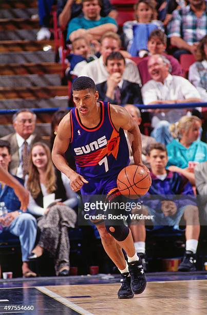 Kevin Johnson of the Phoenix Suns dribbles against the Sacramento Kings circa 1995 at Arco Arena in Sacramento, California. NOTE TO USER: User...