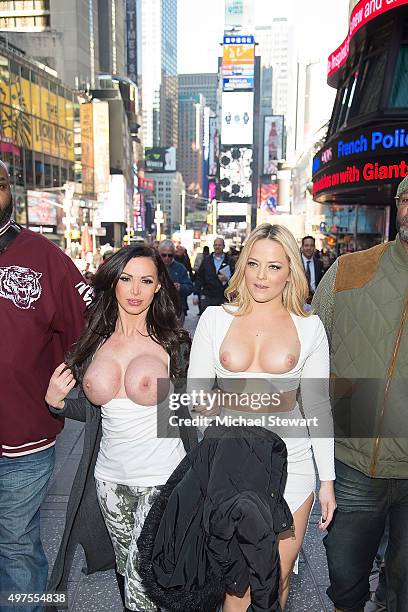 Adult actresses Nikki Benz and Alexis Texas walk topless through Times Square in celebration of gender liberation on November 17, 2015 in New York...