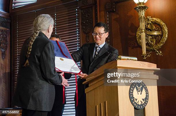 Acting Librarian of Congress David Mao and Rep. Gregg Harper present Willie Nelson with a certificate during the 2015 Gershwin Prize Luncheon...