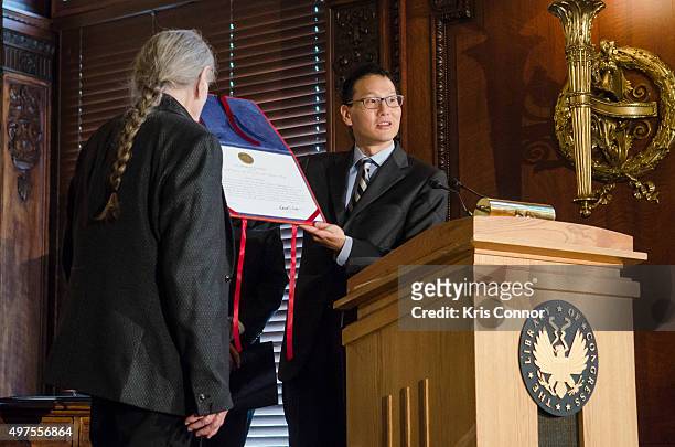 Acting Librarian of Congress David Mao and Rep. Gregg Harper present Willie Nelson with a certificate during the 2015 Gershwin Prize Luncheon...